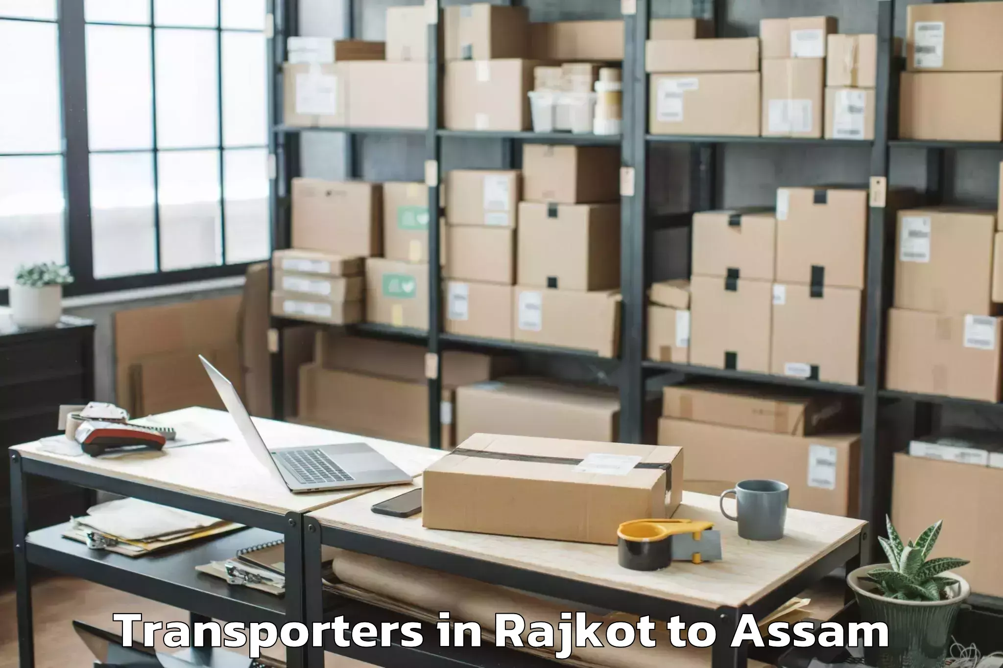 Book Rajkot to Haflong Transporters Online